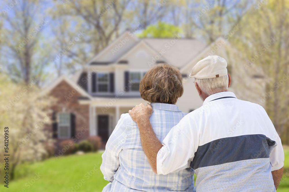 Retired Senior Couple Looking at Front of House